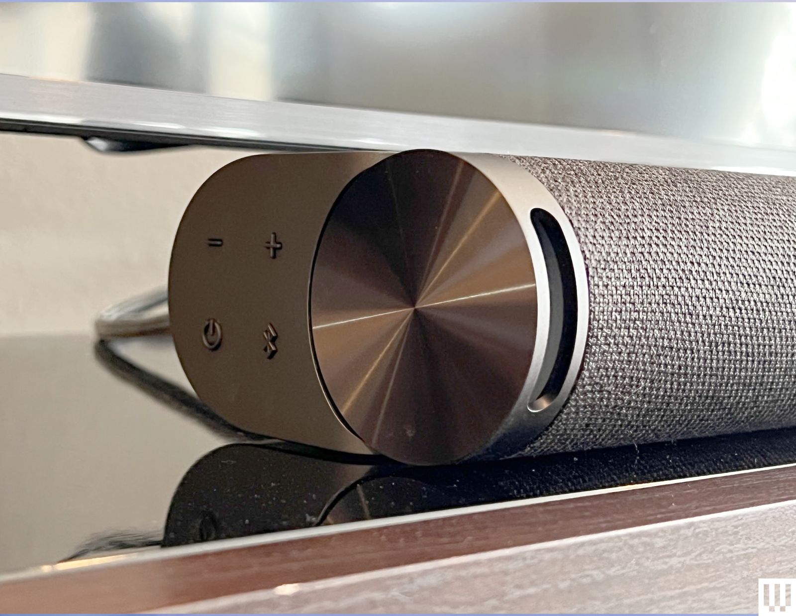 Side view of the Vizio Elevate SE 5.1.2 Soundbar showing the silver endcap and small buttons